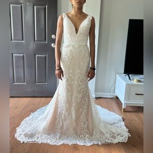 Never worn wedding dress. Mermaid fit, corded lace. Classy, simple, and stunning